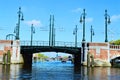 Amstel river, bridge, boats, Netherlands, Europe and colorful buildings Royalty Free Stock Photo