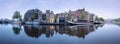 River, traditional old houses and boats, Amsterdam Royalty Free Stock Photo