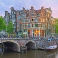 Amstel river, canals and night view of beautiful Amsterdam city. Netherlands