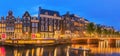 Amstel river, canals and night view of beautiful Amsterdam city. Netherlands