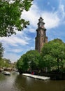 Amstel river and Westerkerk church in Amsterdam. Royalty Free Stock Photo