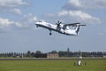 Amsterdam Airport Schiphol - Bombardier Dash 8 of Flybe takes off Royalty Free Stock Photo