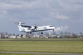 Amsterdam Airport Schiphol - Flybe Bombardier Dash 8 lands Royalty Free Stock Photo