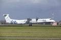 Amsterdam Airport Schiphol - Flybe Bombardier Dash 8 lands Royalty Free Stock Photo