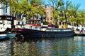 Amsterdam, Amstel river, boats, Netherlands, Europe and colorful buildings Royalty Free Stock Photo