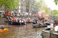 AMSTERDAM - APRIL 26: Amsterdam canals full of boats and people