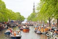 AMSTERDAM - APRIL 26: Amsterdam canals full of boats and people