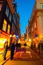 AMSTERDAM-APRIL 27: Nightlife on Amsterdam narrow street in red light district on April 27,2015, the Netherlands. Royalty Free Stock Photo