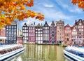 Amsterdam architecture at Damrak canal in autumn, Netherlands Royalty Free Stock Photo