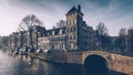 Amsterdam autumn in the morning, old city centre, bridge, canals of Amsterd