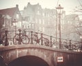 Amsterdam autumn in the morning, old city centre, bridge, canals of Amsterd Royalty Free Stock Photo