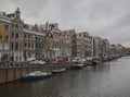 Amsterdam in autumn, traditional buildings along a canal.
