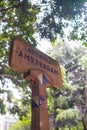 Amsterdam avenue sign with blurry tree as background