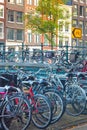 Amsterdam - bicycles in Europe..Ecological transport..Many bicycles are parked on the street and traditional old European houses. Royalty Free Stock Photo