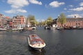 Amsterdam with boats on canal in Holland Royalty Free Stock Photo