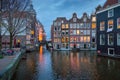 Amsterdam buildings at dusk with water canals and reflections, Netherlands Royalty Free Stock Photo