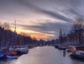 Amsterdam canal Amstel with typical dutch houses and houseboat from the boat in the evening, Holland, Netherlands Royalty Free Stock Photo