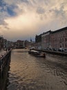 Amsterdam canal Amstel with typical dutch houses and houseboat from the boat in the evening, Holland, Netherlands Royalty Free Stock Photo