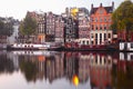 Morning Amsterdam canal with dutch houses Royalty Free Stock Photo