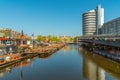 Amsterdam canal, cruise boats and bicycle parking, central train station area, North Holland, Netherlands, transport, traveling