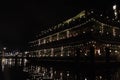 Amsterdam canal at night view floating restaurant
