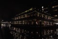 Amsterdam canal at night view floating restaurant