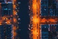 Amsterdam canal, old dancing houses, river Amstel and illuminated streets, aerial top view at night, drone photo Royalty Free Stock Photo