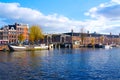 Amsterdam canal river with bridge in autumn Netherlands Royalty Free Stock Photo