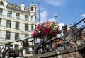 Amsterdam canal scene with bicycles and bridges Royalty Free Stock Photo