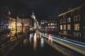 Amsterdam canals and houses against night cityscape of Amsterdam, Holland Netherlands Royalty Free Stock Photo