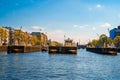 Amsterdam canals and typical dutch houses with narrow streets filled with bicycles in Netherlands Royalty Free Stock Photo