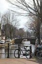 Amsterdam canals in winter. Classic views of bridges and bicycles