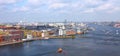 Amsterdam cityscape. Panoramic distance view of industrial area port area and Amstel river waterway. Netherlands