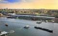 Amsterdam cityscape top view at sunset. River with ships, boats, Central station. Sightseeing of Dutch