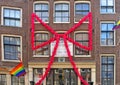 Amsterdam. Close detail of traditional Dutch house, headquarters of the gay association in Amsterdam with ornaments d