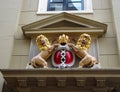 Amsterdam coat of arms on the facade of the city building.