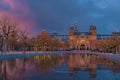 Amsterdam in a cold night during spring season. Famous national Rijks museum general view reflecting in tha water at dusk