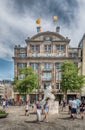 Bijenkorf on the Dam Square in the summer, people on the streets shopping