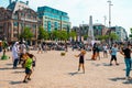 Kids playing with soap bubbles on the Dam Square in the summer