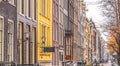 Amsterdam. Facades of traditional Dutch buildings of different colors. Windows Royalty Free Stock Photo