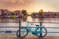 Amsterdam, with flowers and bicycles on the bridges over the canals, Holland, Netherlands. Royalty Free Stock Photo