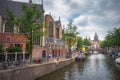 Amsterdam, with flowers and bicycles on the bridges over the canals, Holland, Netherlands. Royalty Free Stock Photo