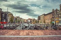 Amsterdam, with flowers and bicycles on the bridges over the canals, Holland, Netherlands. Royalty Free Stock Photo