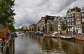 Amsterdam, Holland, August 2019. Classic view on one of the canals of the historic center. The typical houses overlook the water,