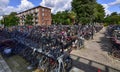 Amsterdam, Holland, August 2019. In the modern suburbs a large outdoor parking for bicycles. Thanks to two-level racks you can Royalty Free Stock Photo