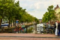 Amsterdam, Holland, August 2019. The red frame of a bike parked on a bridge captures the attention giving an image that is a Royalty Free Stock Photo