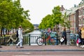 Amsterdam, Holland, August 2019. The red frame of a bike parked on a bridge captures the attention giving an image that is a Royalty Free Stock Photo