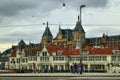 Amsterdam, Holland, August 2019. In a single view the central metro station, with its white facade, and behind it the tallest and