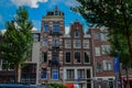 Amsterdam, Holland, August 2019. The typical and charming houses: they are a symbol of the city represented on a postcard. With