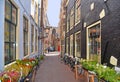 Amsterdam, Holland. Cityscape with with narrow street and facade of old buildings in historical centre of Duch capital,